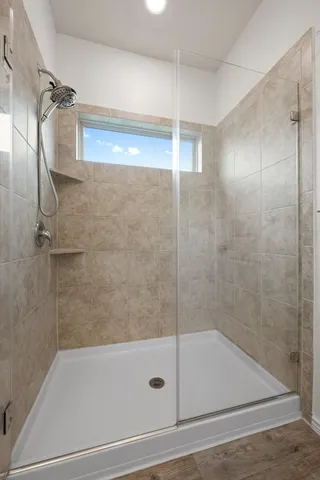 a bathroom with a bathtub and a shower