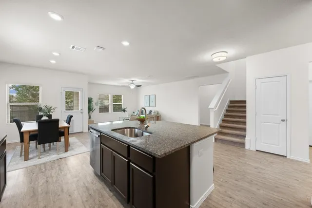 a kitchen with sink and island
