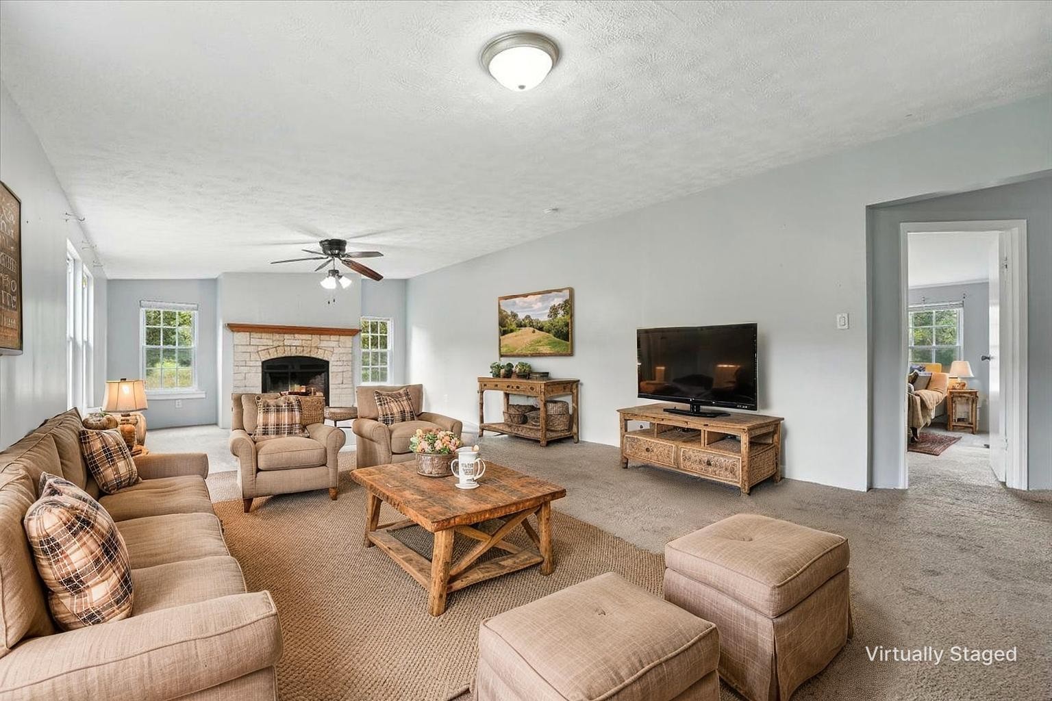 9484 Rocky Hill Road Lascassas, TN 37085 - Photo 13 of 38 a living room with furniture a fireplace and a flat screen tv