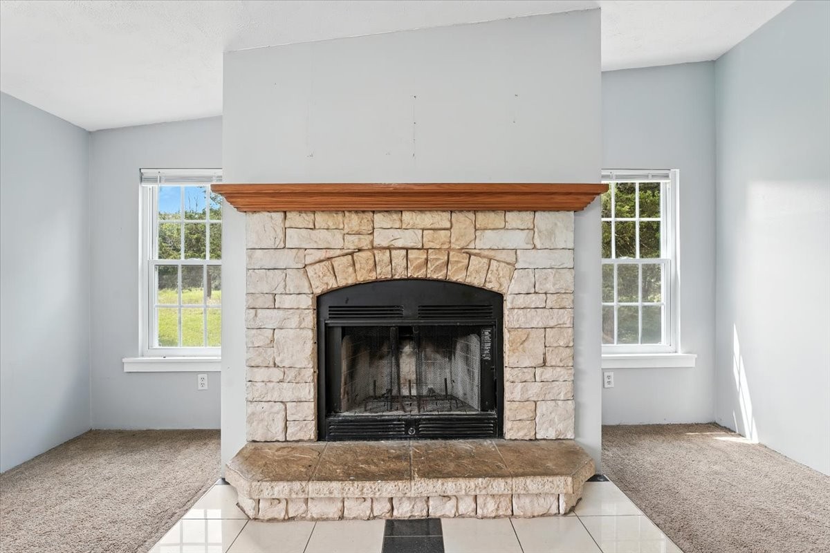 9484 Rocky Hill Road Lascassas, TN 37085 - Photo 15 of 38 a view of an empty room with a fireplace and a window