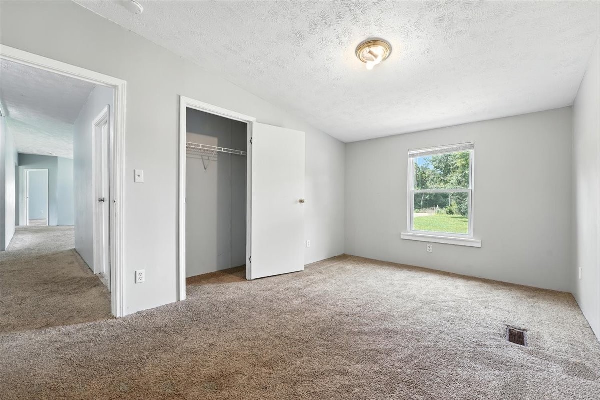 9484 Rocky Hill Road Lascassas, TN 37085 - Photo 24 of 38 a view of an empty room with a window