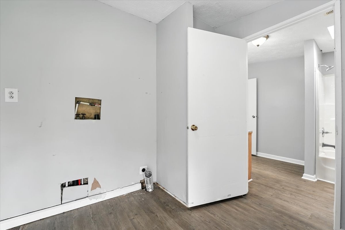 9484 Rocky Hill Road Lascassas, TN 37085 - Photo 28 of 38 an empty room with wooden floor and white doors