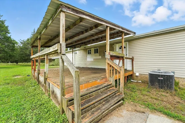 a view of a house with a small yard