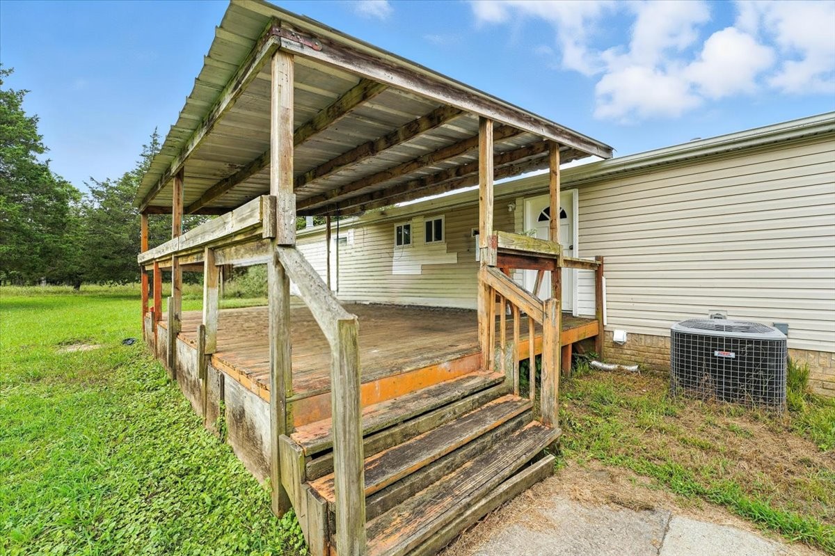 9484 Rocky Hill Road Lascassas, TN 37085 - Photo 30 of 38 a view of a house with a small yard