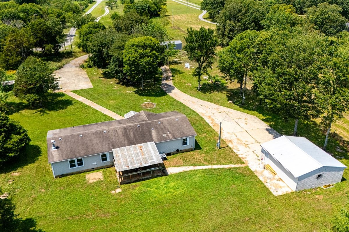 9484 Rocky Hill Road Lascassas, TN 37085 - Photo 33 of 38 an aerial view of a house with a garden and swimming pool