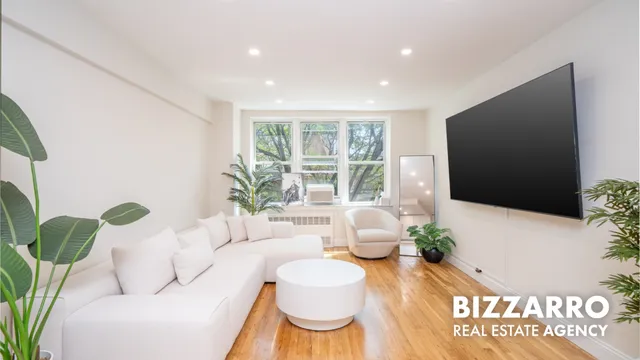 a living room with furniture potted plant and a window