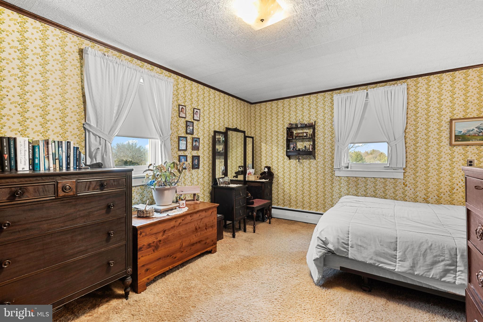 954 Anderson Ferry Road Mount Joy, PA 17552 - Photo 18 of 40 a spacious bedroom with a bed and wooden floor
