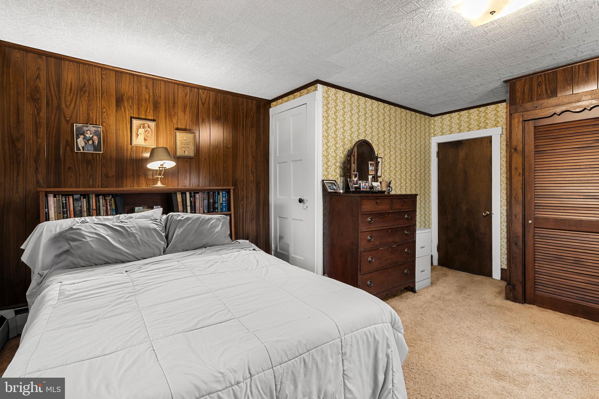 954 Anderson Ferry Road Mount Joy, PA 17552 - Photo 19 of 40 a bed room with a bed and a dresser