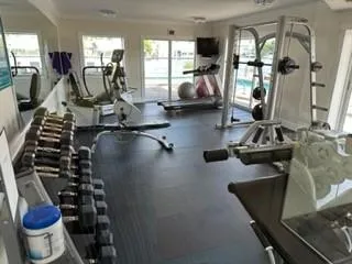 a view of kitchen with furniture and refrigerator