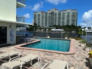 Undisclosed Address Fort Lauderdale, FL 33306 - Photo 20 of 26 a view of a lake with a building and outdoor seating