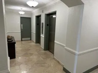 a view of entryway with a hallway and a closet