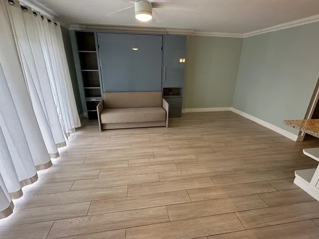 a living room with a couch and a rug