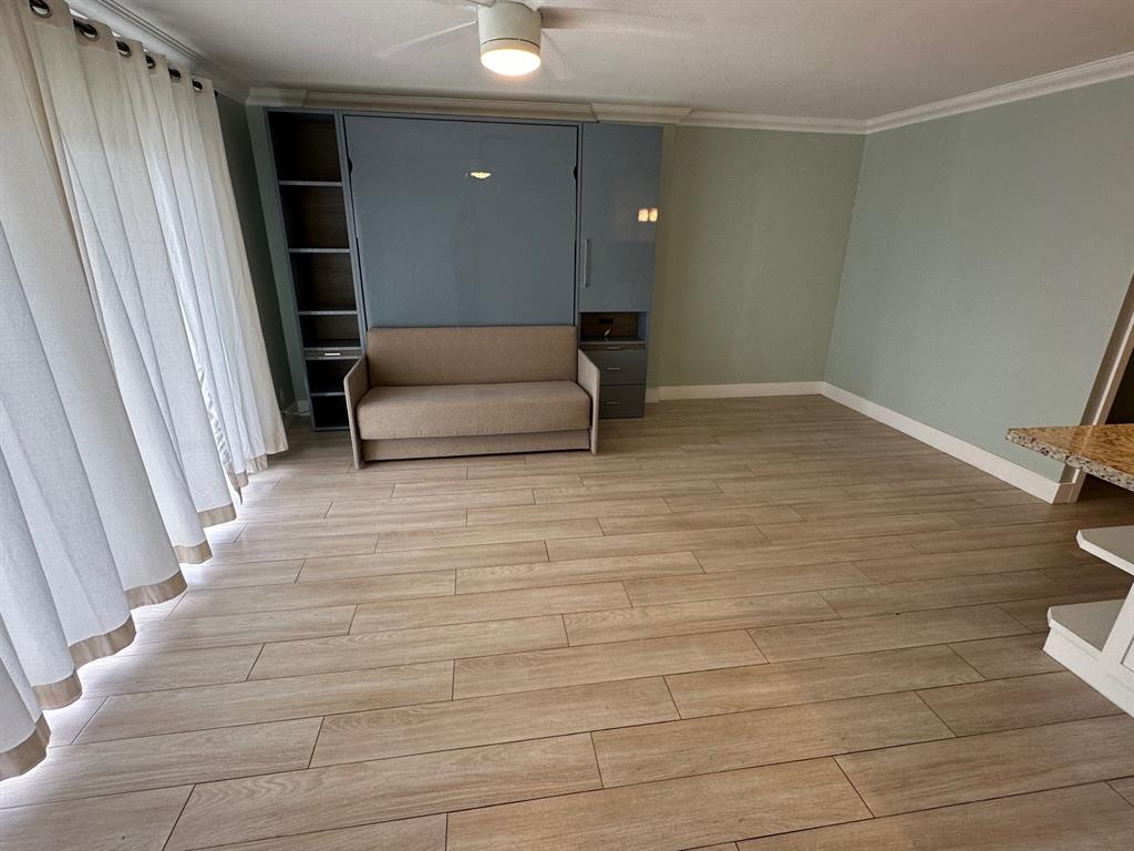 Undisclosed Address Fort Lauderdale, FL 33306 - Photo 6 of 26 a living room with a couch and a rug