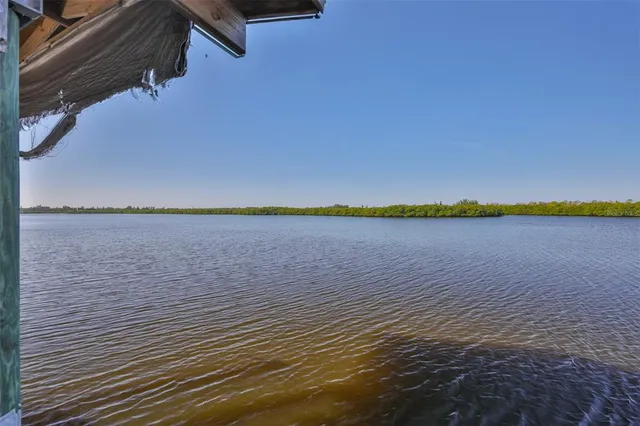 a view of an empty room with a kitchen