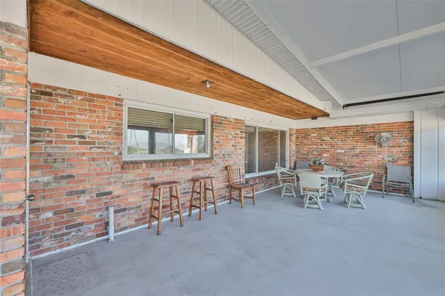 a view of a livingroom with a ceiling fan and a window