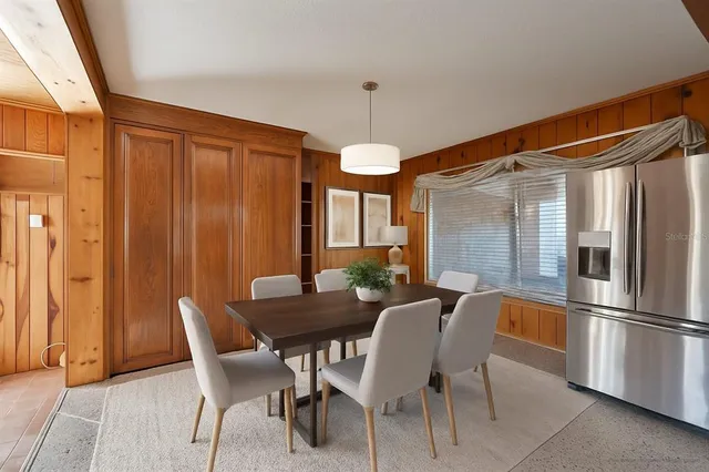 a view of a storage & utility room with a ceiling fan