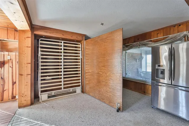 a living room with furniture a fireplace and a table