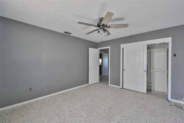 an aerial view of a house with a yard and lake view