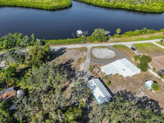 an aerial view of a house with garden space and sitting space