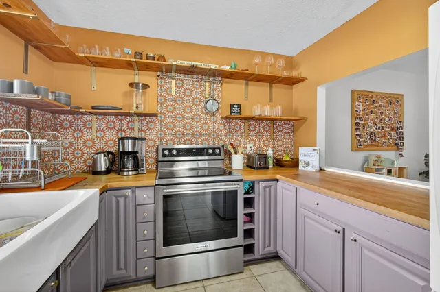 a view of a kitchen area with furniture and a window