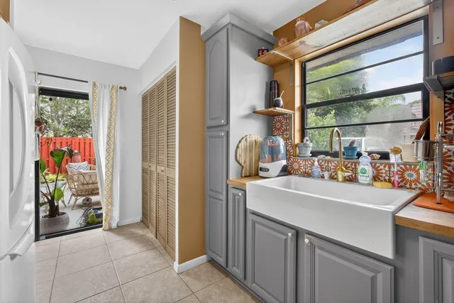 a kitchen with a sink and cabinets