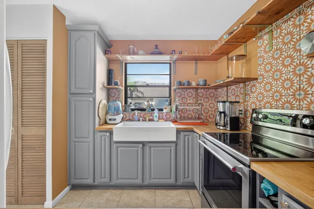 a kitchen with a refrigerator and countertop