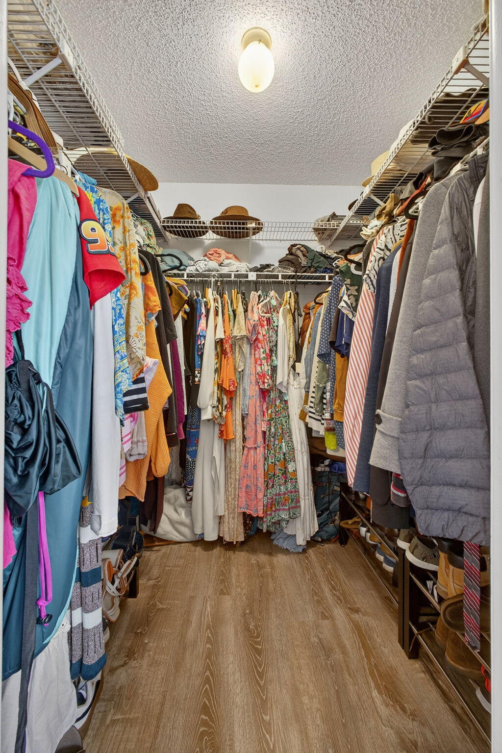 326 Jupiter Lakes Boulevard, Unit 2310C Jupiter, FL 33458 - Photo 40 of 46 a view of walk in closet with clothes