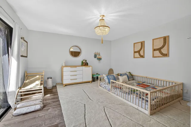 a bedroom with a bed and a table in it