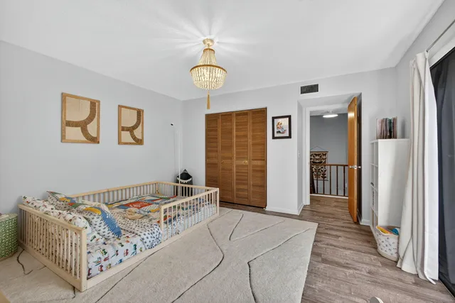 a bedroom with furniture and a window