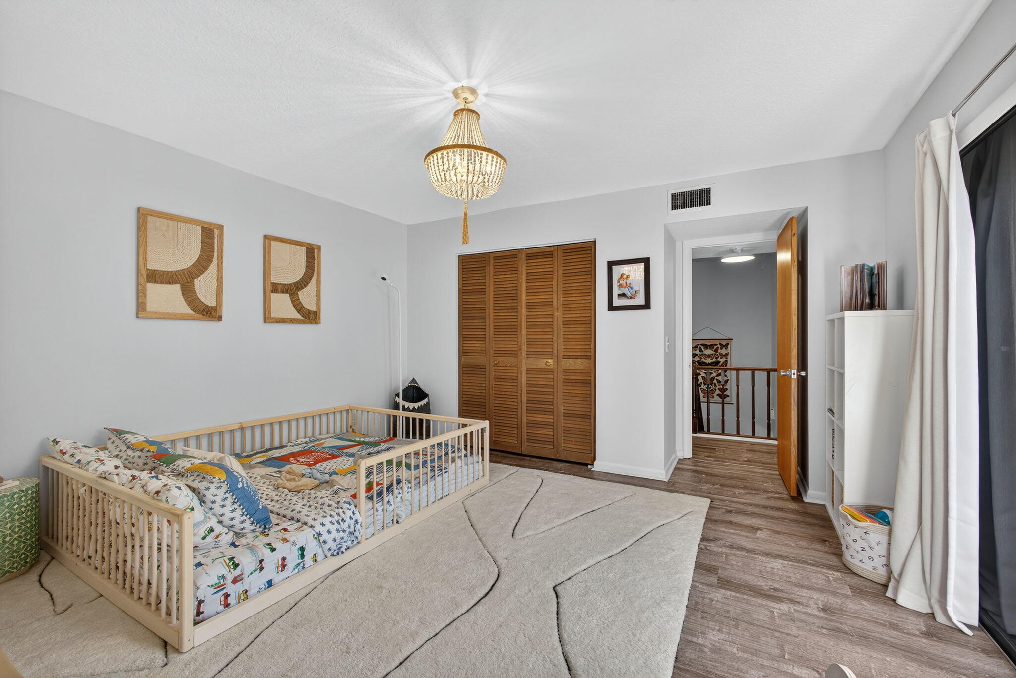 326 Jupiter Lakes Boulevard, Unit 2310C Jupiter, FL 33458 - Photo 42 of 46 a bedroom with a bed and a table in it