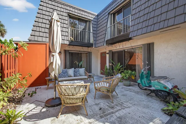 a view of a chair and table in the patio
