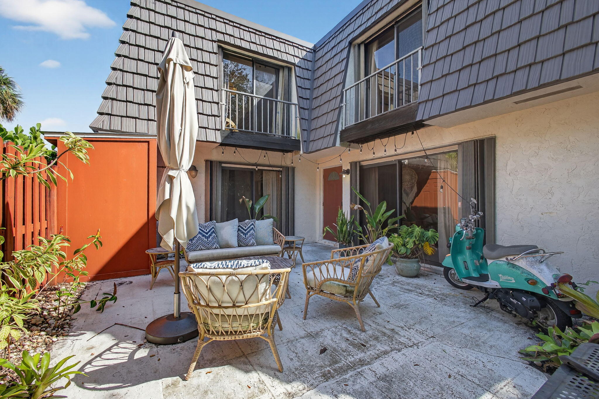 326 Jupiter Lakes Boulevard, Unit 2310C Jupiter, FL 33458 - Photo 6 of 46 a view of a chair and table in the patio