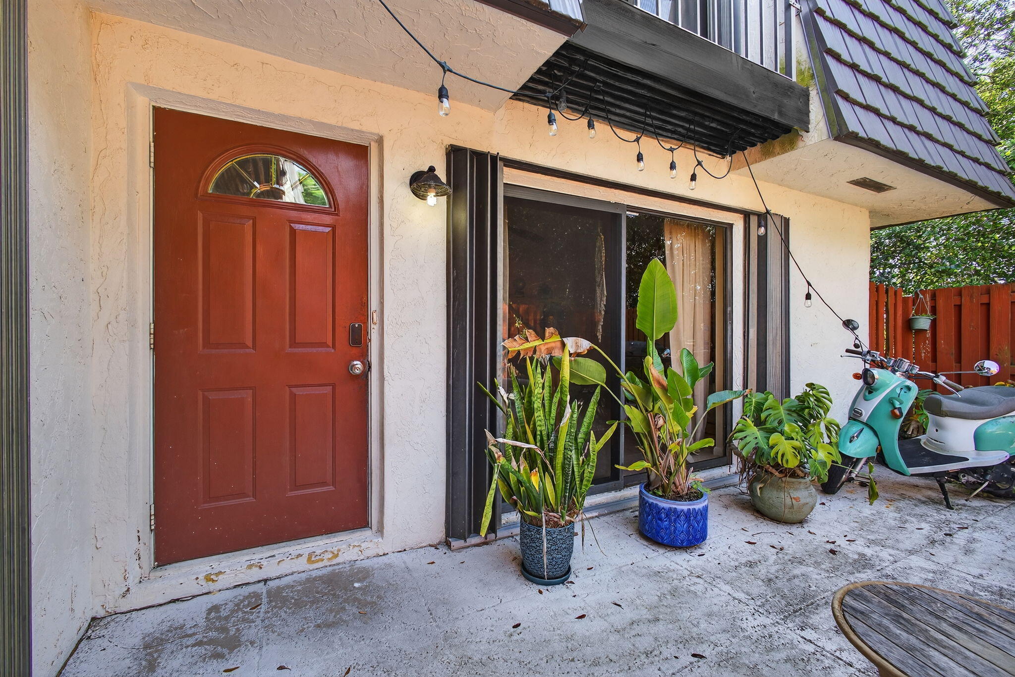326 Jupiter Lakes Boulevard, Unit 2310C Jupiter, FL 33458 - Photo 7 of 46 a view of a porch with potted plants