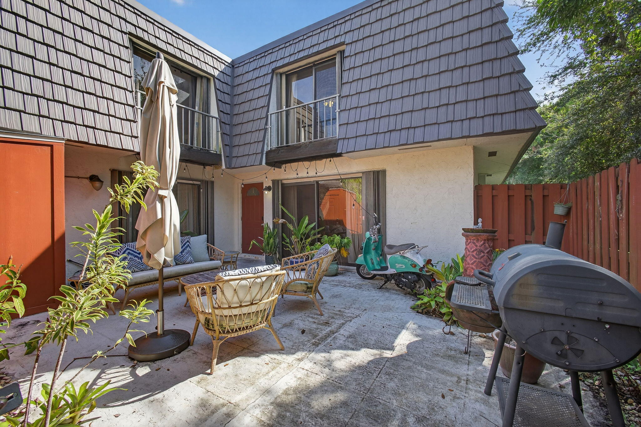 326 Jupiter Lakes Boulevard, Unit 2310C Jupiter, FL 33458 - Photo 9 of 46 a view of an outdoor sitting area