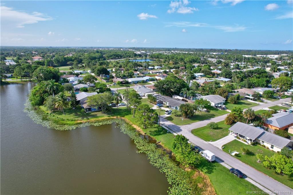 4651 Southeast Chatham Avenue Stuart, FL 34997 - Photo 17 of 49 an aerial view of residential houses with outdoor space and lake view
