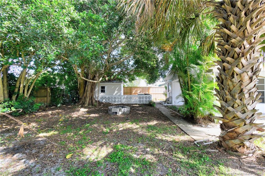 4651 Southeast Chatham Avenue Stuart, FL 34997 - Photo 23 of 49 a backyard of a house with seating space