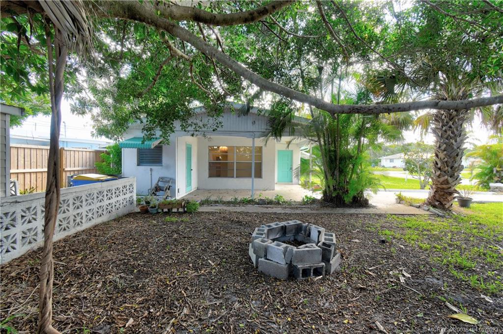 4651 Southeast Chatham Avenue Stuart, FL 34997 - Photo 28 of 49 a view of a house with backyard sitting area and garden