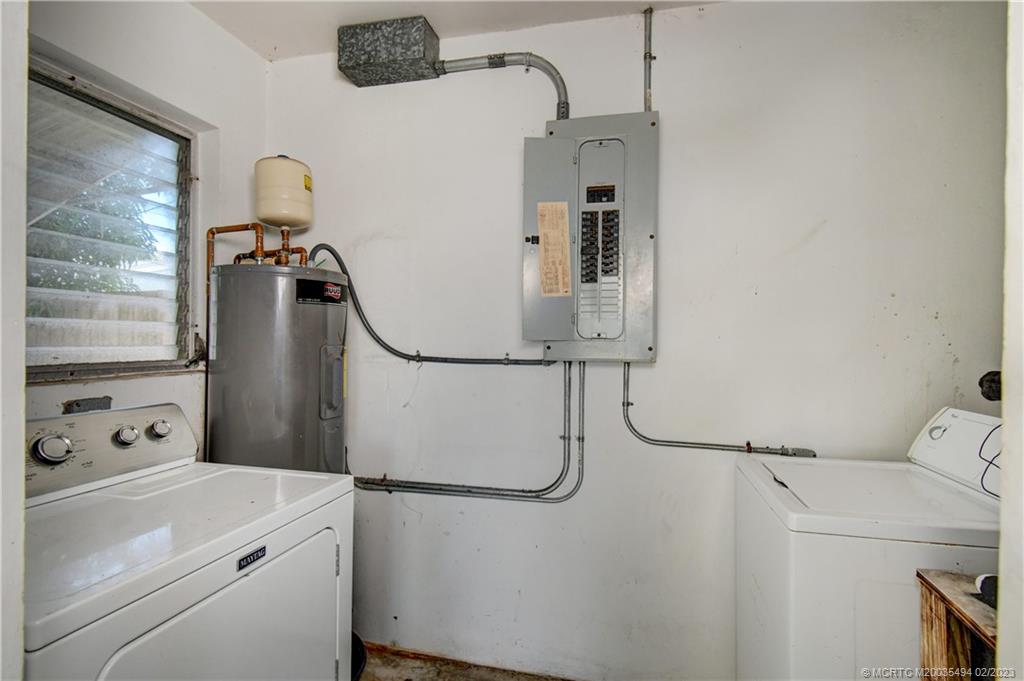 4651 Southeast Chatham Avenue Stuart, FL 34997 - Photo 36 of 49 a utility room with dryer and washer