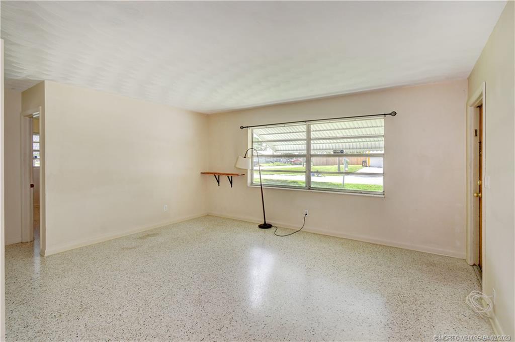 4651 Southeast Chatham Avenue Stuart, FL 34997 - Photo 46 of 49 an empty room with windows