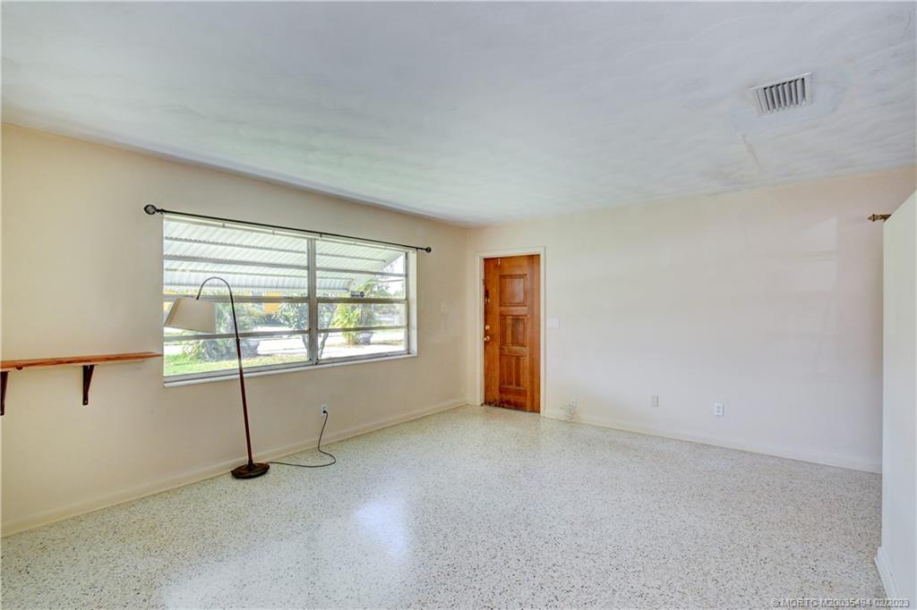 4651 Southeast Chatham Avenue Stuart, FL 34997 - Photo 48 of 49 an empty room with windows