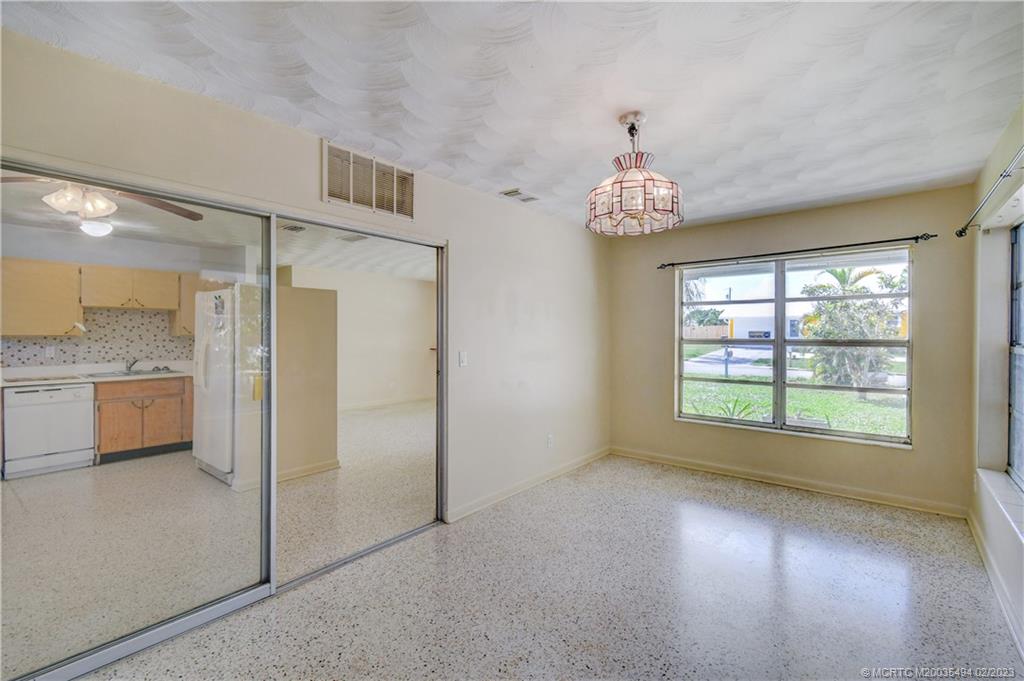 4651 Southeast Chatham Avenue Stuart, FL 34997 - Photo 5 of 49 a view of an empty room with a window