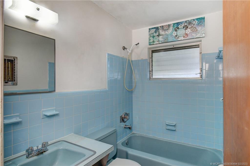 4651 Southeast Chatham Avenue Stuart, FL 34997 - Photo 8 of 49 a bathroom with a sink and a bathtub