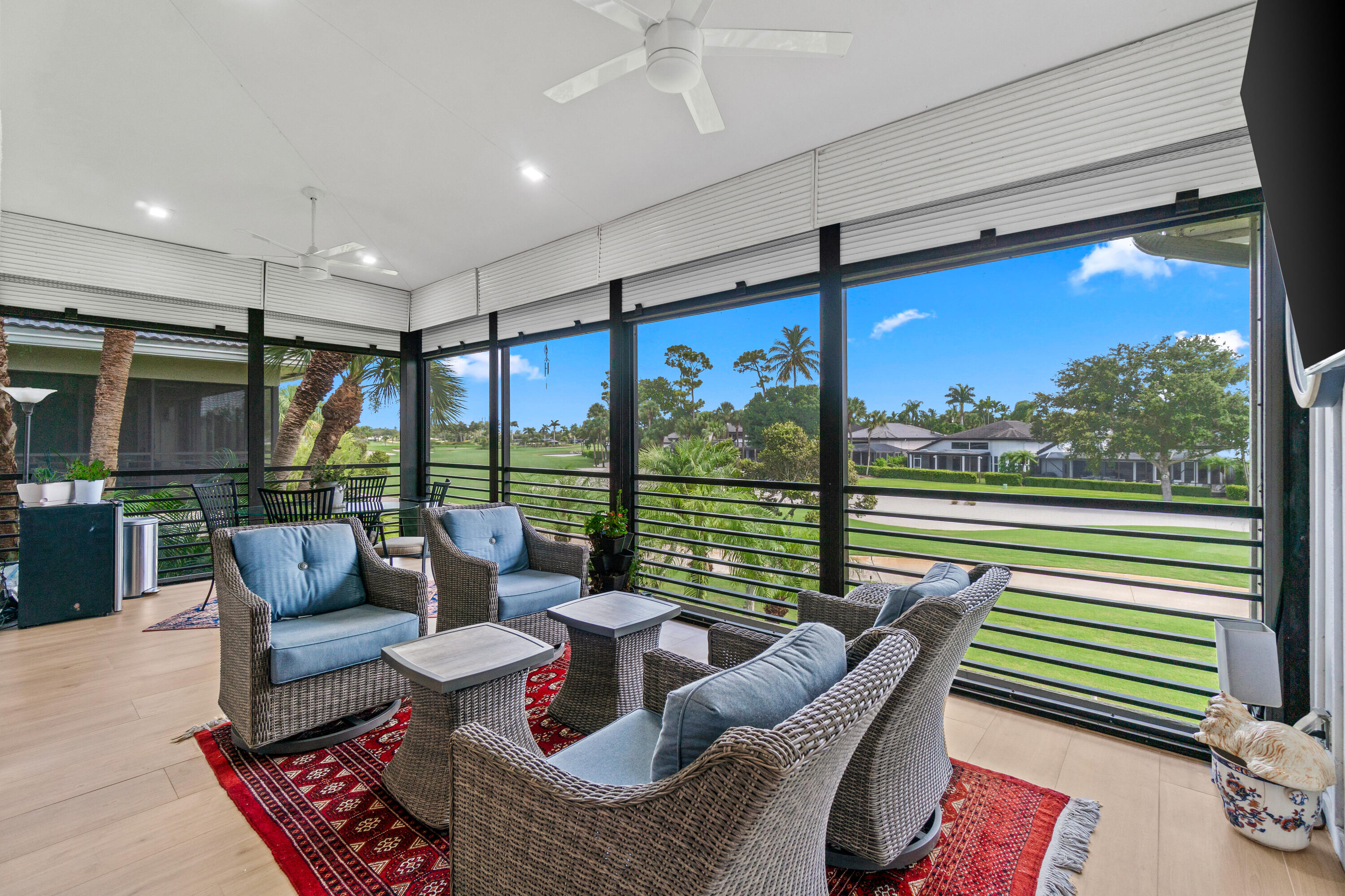 17557 Ashbourne Lane, Unit B Boca Raton, FL 33496 - Photo 13 of 41 a living room with furniture and a floor to ceiling window