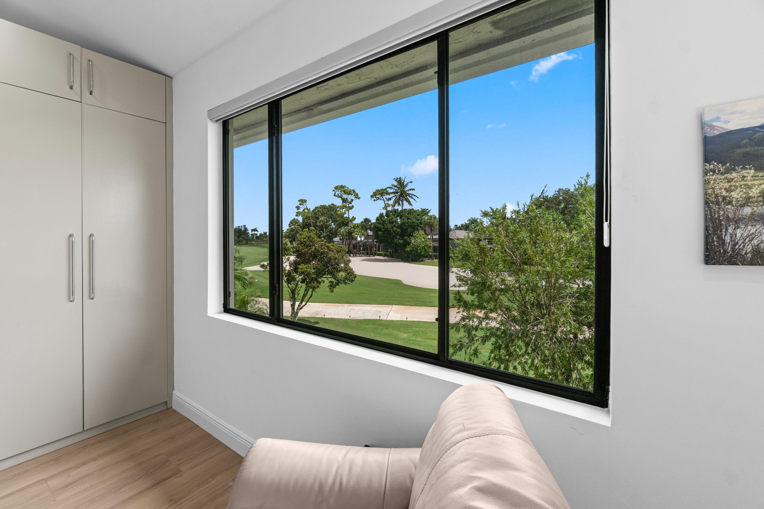 17557 Ashbourne Lane, Unit B Boca Raton, FL 33496 - Photo 20 of 41 a view of a large window with plants and outdoor view