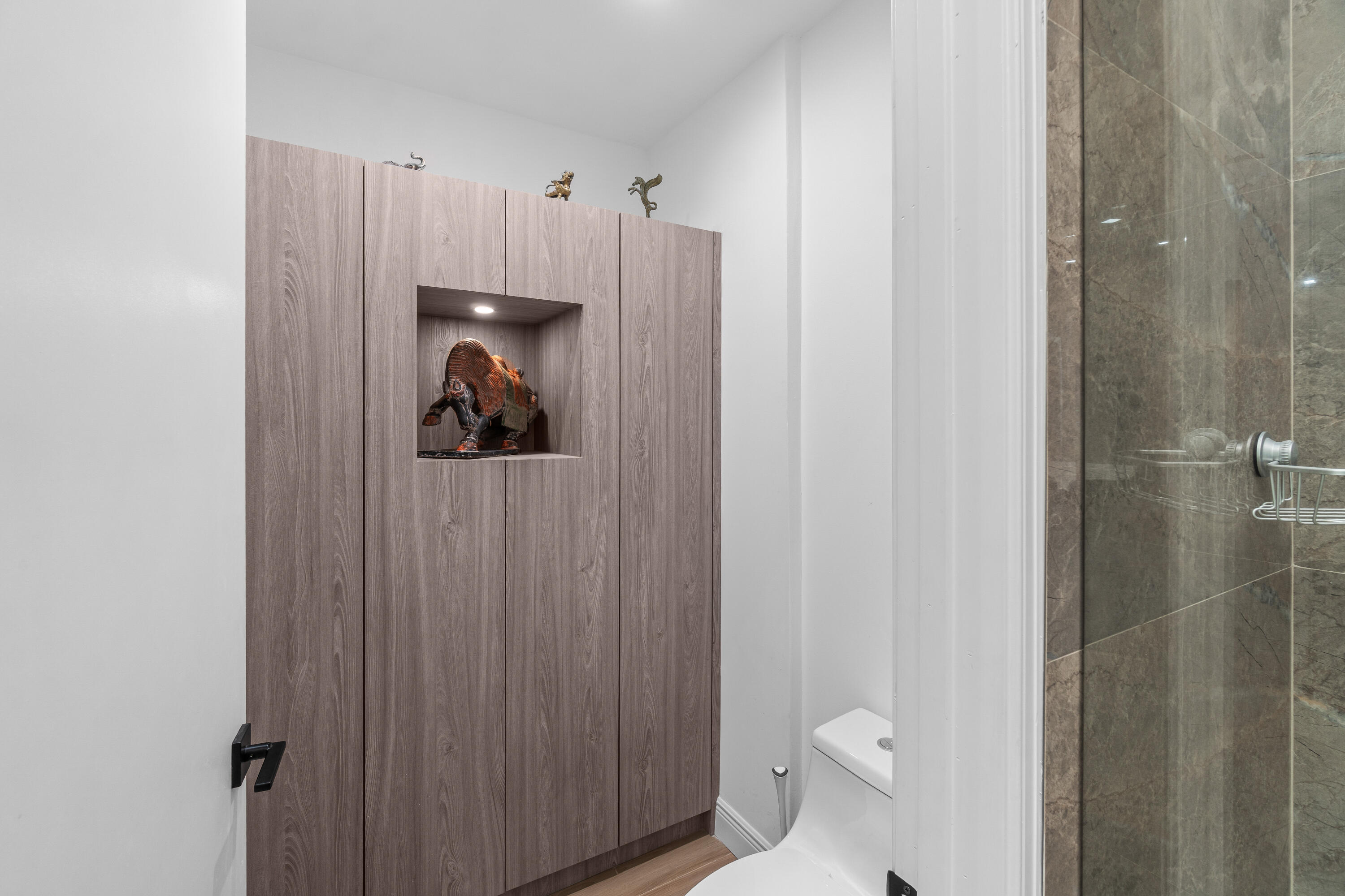 17557 Ashbourne Lane, Unit B Boca Raton, FL 33496 - Photo 24 of 41 a view of a bathroom with a sink and toilet