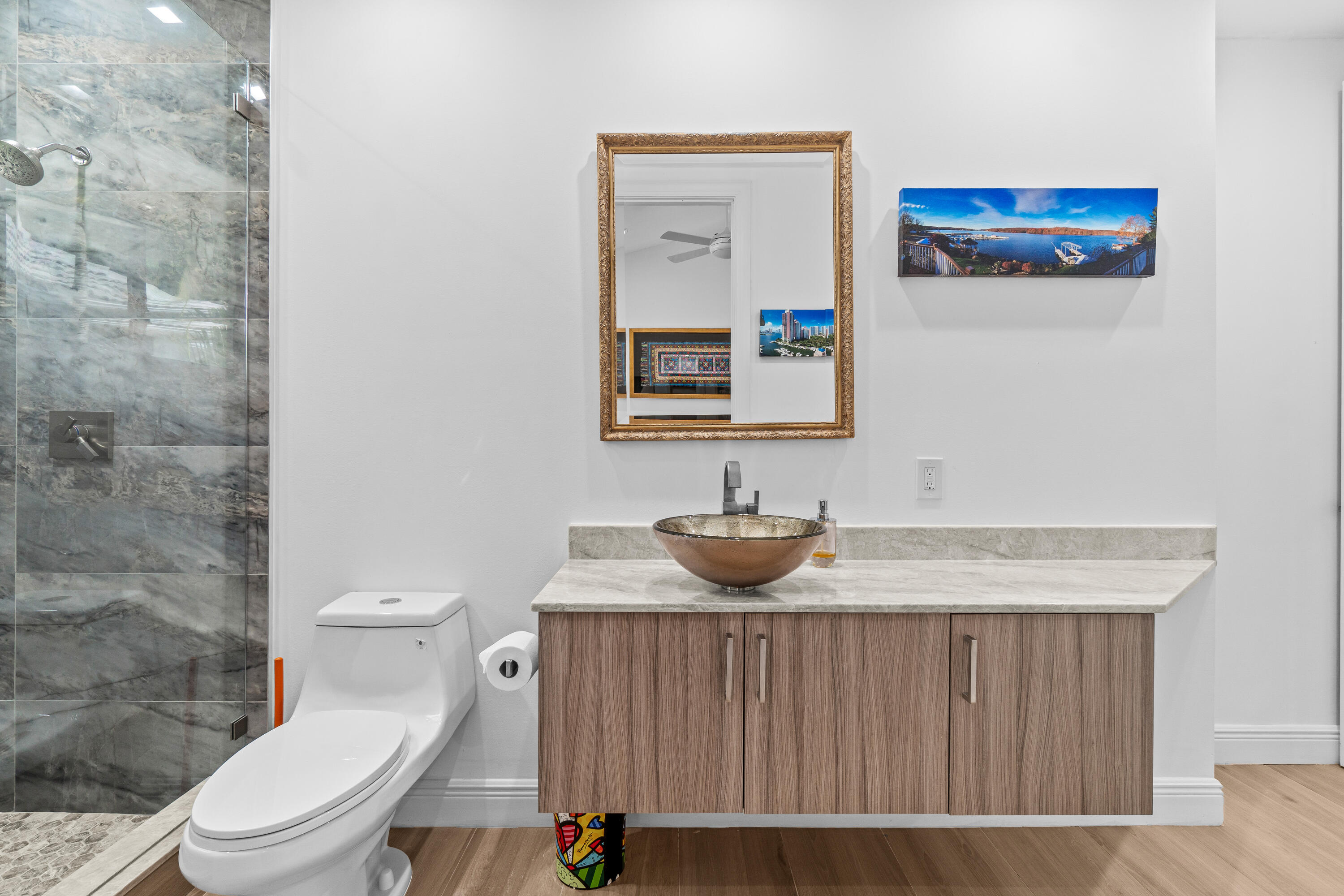 17557 Ashbourne Lane, Unit B Boca Raton, FL 33496 - Photo 27 of 41 a bathroom with a sink and a toilet