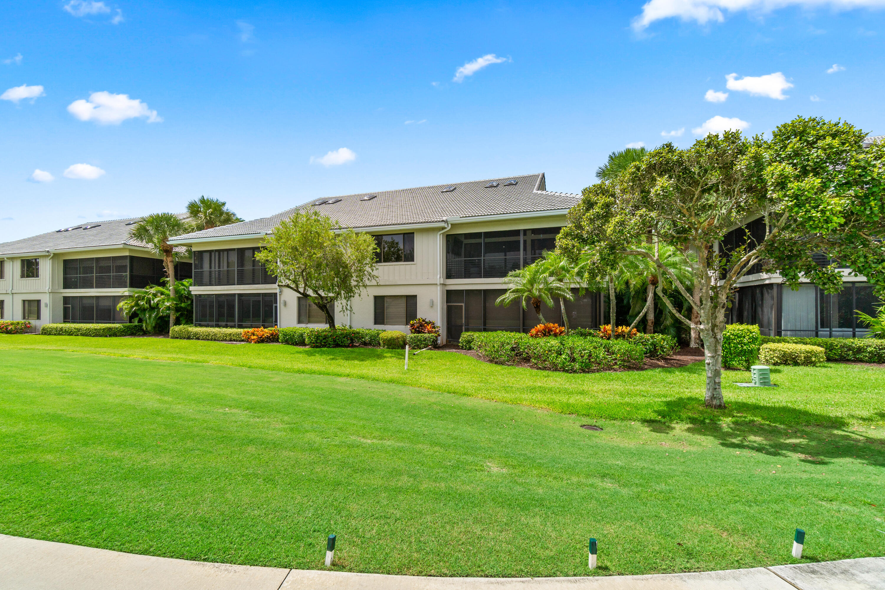 17557 Ashbourne Lane, Unit B Boca Raton, FL 33496 - Photo 38 of 41 a front view of house with a garden