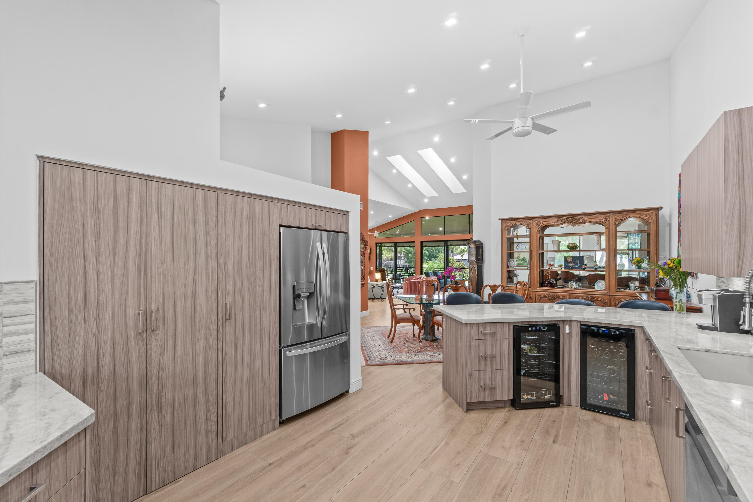 17557 Ashbourne Lane, Unit B Boca Raton, FL 33496 - Photo 5 of 41 a kitchen with stainless steel appliances granite countertop lots of counter top space and refrigerator