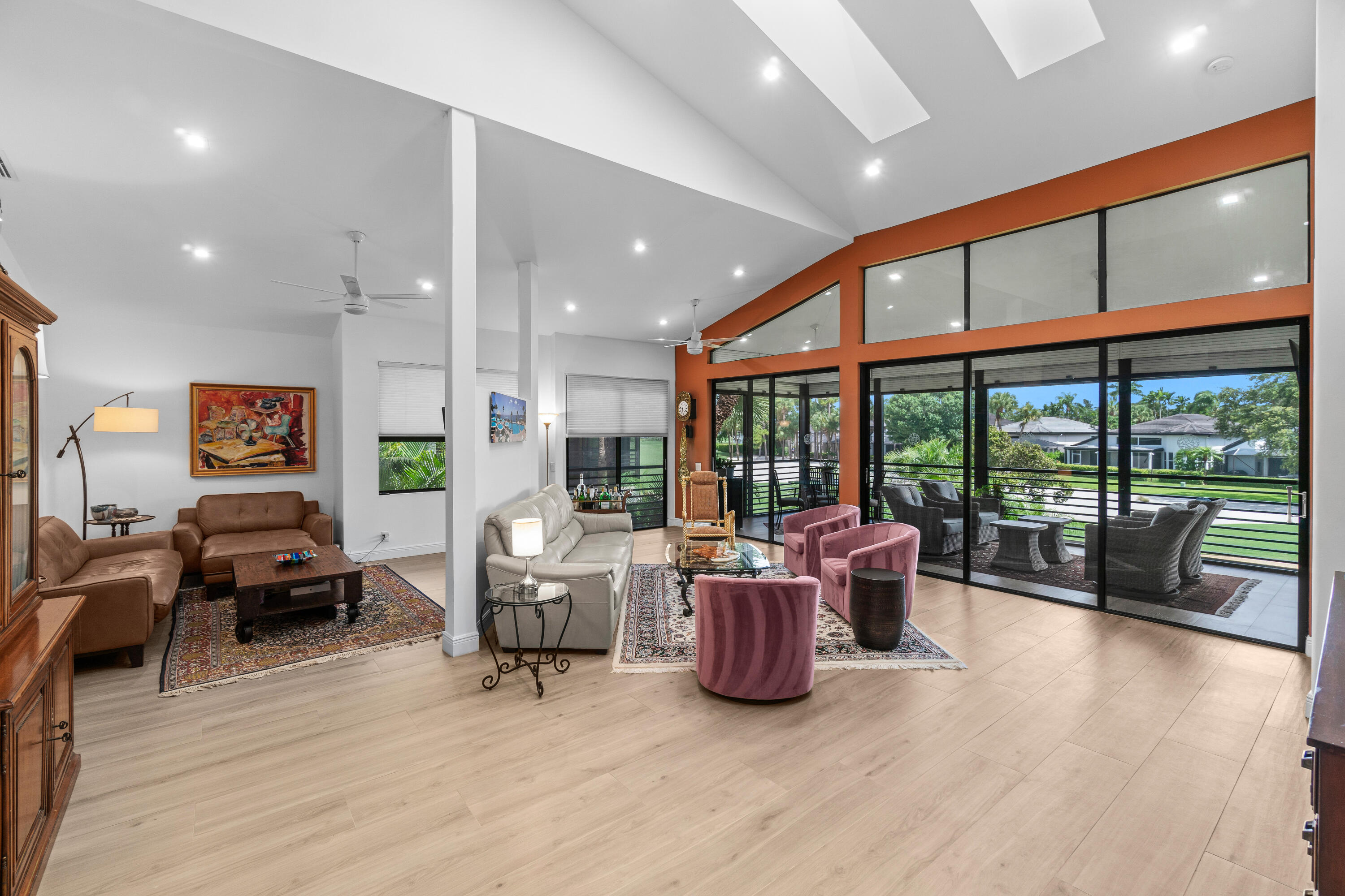 17557 Ashbourne Lane, Unit B Boca Raton, FL 33496 - Photo 8 of 41 a living room with furniture and floor to ceiling window