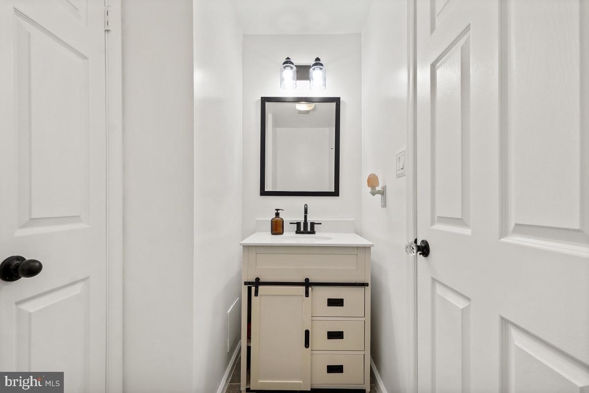 1515 Church Hill Place Reston, VA 20194 - Photo 17 of 28 Stylish powder room with modern vanity